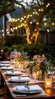 ai generado un hermosa al aire libre jardín fiesta completar con hada luces y floral centros de mesa foto