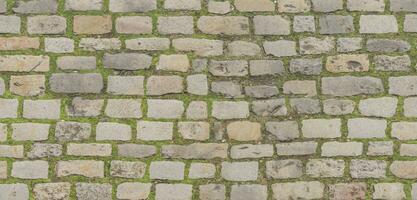la carretera superficie hecho de cuadrado piedras grava acera detalle de adoquines en antiguo la carretera antiguo granito la carretera 3d ilustración foto