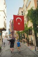 turkey istanbul 12 june 2023. hanging Turkish Flag on buildings at balat photo