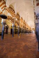 La Mezquita Cathedral in Cordoba, Spain. The cathedral was built inside of the former Great Mosque. photo