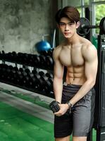 AI generated Young Asian male model, bright smile, good figure, exercise background at the gym, high resolution. The whole picture is sharp. Generate AI photo