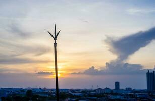 Lightning rod on the rooftop of condominium in evening time photo