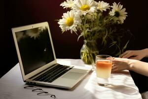 AI generated woman's laptop on white table with notebook, flowers, plants, wine glasses photo