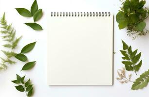 AI generated white background with empty notepad and green leaves around a white background photo