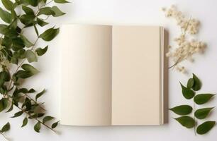 AI generated a white blank book surrounded by green leaves photo