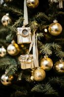 AI generated the golden ornaments hanging from a christmas tree photo