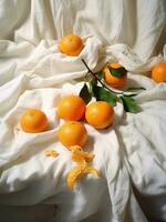 AI generated eight tangerines on white cloth, with green leaves, everyday ephemera, organic material photo