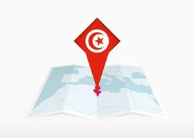 Tunisia is depicted on a folded paper map and pinned location marker with flag of Tunisia. vector