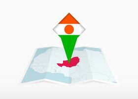 Niger is depicted on a folded paper map and pinned location marker with flag of Niger. vector