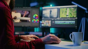 Video editor arranging recorded stock clips into seamless whole in creative multimedia agency. Videographer manipulating film pieces, assembling recorded footage into finished project