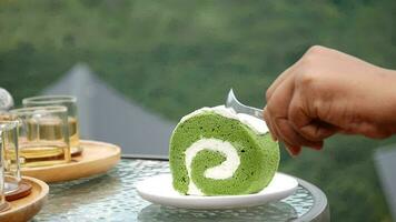 Human hand cut piece of white cake on plate close up, Piece of creamy sweet cake being cut and eaten with fork, cake slice on plate with human hand close up video