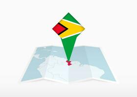 Guyana is depicted on a folded paper map and pinned location marker with flag of Guyana. vector