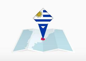 Uruguay is depicted on a folded paper map and pinned location marker with flag of Uruguay. vector