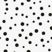 Simple minimalistic seamless pattern, black hand-drawn dots of different sizes on a white background. Sugar sprinkles, confetti. vector