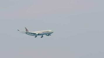 PHUKET, THAILAND - FEBRUARY 27, 2023. Boeing 777 of Qatar Airways with FIFA World Cup 2022 Livery landing at Phuket airport. Wide-body heavy board approaching video