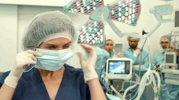 Surgical nurce puts on medical mask video