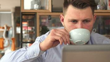 Young businessman drink coffee at the cafe video