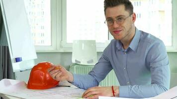 Architect smiles at the table video