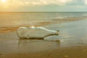 Glass bottles on the beach photo