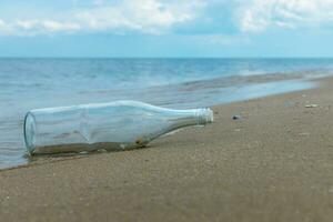 Glass bottles on the beach photo