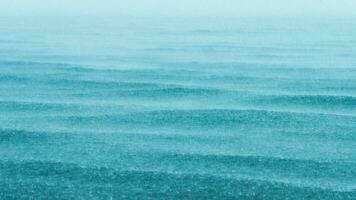 raining in the sea during the rainy season. photo