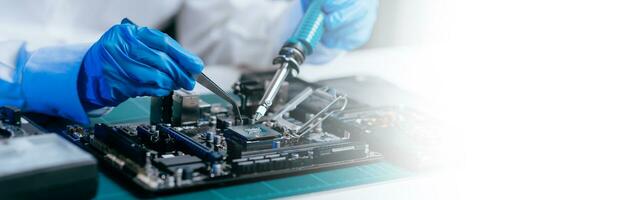 The technician is putting the CPU on the socket of the computer motherboard. electronic engineering electronic repair, electronics measuring and testing, repair photo