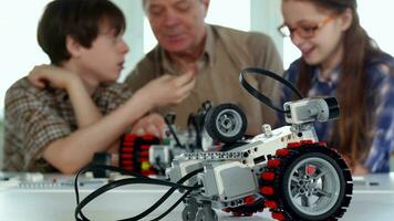 Senior man plays with his grandchildren video