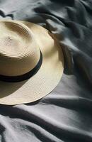 AI generated a straw hat, sunglasses and a straw bucket hat lying on a white blanket, photo