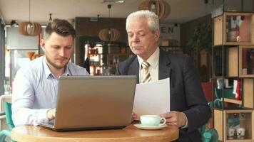 Partners have business meeting at the cafe video