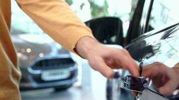 Senior man demonstrate interior of rear door of new car video