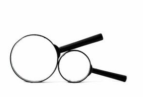 two magnifying glasses on a white background photo