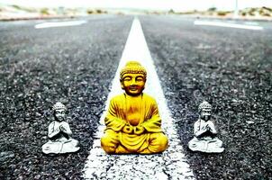 buddha statue on the road photo