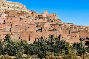 the city of morocco is built on a hillside photo