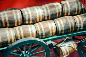 a cart with barrels on it sitting on a table photo