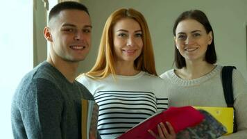 Three students pose at the college video