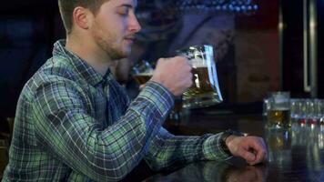 Man drinks beer at the pub video