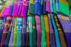 colorful satin are displayed in a store photo