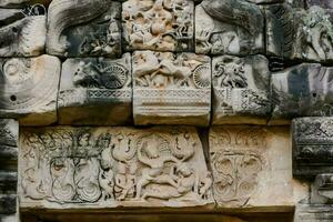 carvings on the wall of an ancient building photo