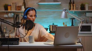 Famous blogger streaming from home studio using professional recording gear. Onair online production internet broadcast show host streaming live content, recording digital social media communication photo