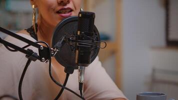 Close up of woman talking on microphone during streaming. Onair online production internet broadcast show host streaming live content, recording digital social media communication photo