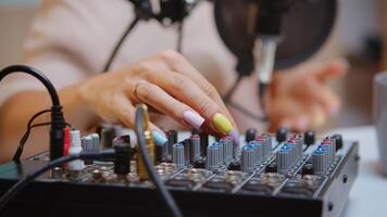 Content creator checking sound on dj mixer for better podcast. Creative online show presenter, Onair online production internet broadcast show host streaming live content, recording digital media photo