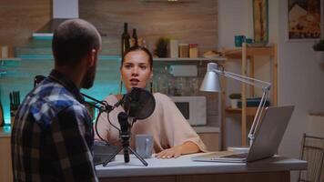 Rear view of guest speaking with host during her online show. Creative online show Onair production internet broadcast presenter streaming live content, recording digital social media communication photo