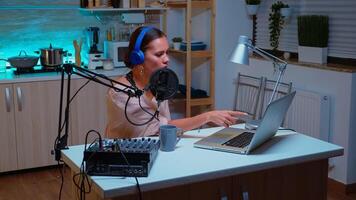 Vlogger messaging her online audience while recording podcast in home studio for social media. Creative online show Onair production internet broadcast host streaming live content, recording digital social media communication photo