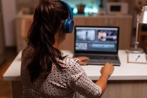 Content creator working in home during night time . photo