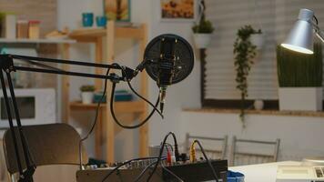 Microphone and mixer for podcast of famous influencer. Recording social media content with production microphone. Digital web internet streaming station photo