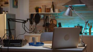 Professional setup for recording podcast in home studio of vlogger. Influencer recording social media content with production microphone. Digital web internet streaming station photo