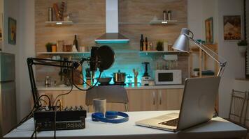 Station for recording and speaking during podcast. Influencer recording social media content with production microphone. Digital web internet streaming station photo