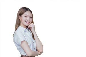 Portrait of adult Thai student in university student uniform. Asian beautiful girl standing with her arms crossed while isolated on white background. photo