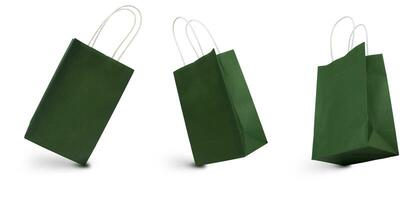 Gift paper bags of green color isolated on a white background. photo