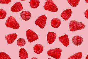 Seamless berry pattern. Ripe raspberries on a pink background. photo